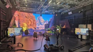 A virtual TV production studio with an image or large rock outcrops in the background