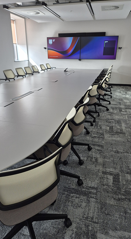 Boardroom and meeting rooms with integrated audio visual and hybrid video conferencing technology