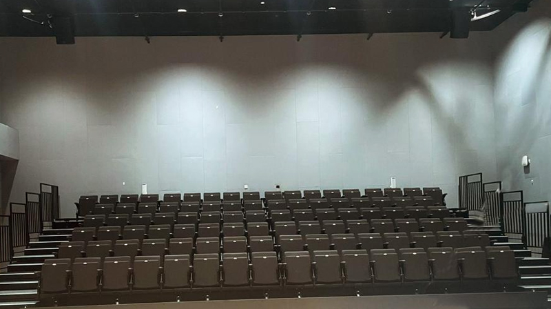 Drama studio theatre seating at American Community School Abu Dhabi, showing the audience seating arrangement within the performance space.