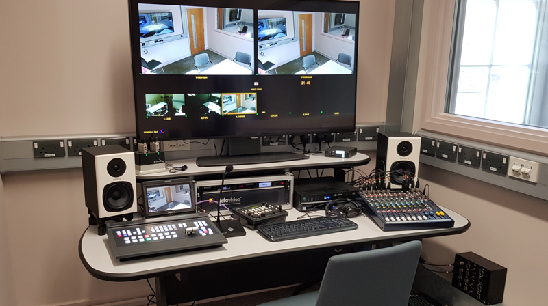 Video production gallery for the University of Greenwich psychology observation laboratories, showing the control desk and video monitoring equipment.