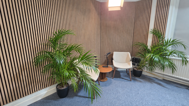 Podcast recording area at the University of Greenwich, showing the seating arrangement, microphones and studio equipment.